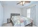 Bedroom with full-sized bed, bedside table, ceiling fan, and closet at 3012 Magnolia Meadows Dr, Plant City, FL 33567