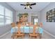 Dining room with wooden table set for six and a large china cabinet in the background at 3012 Magnolia Meadows Dr, Plant City, FL 33567