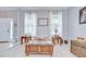 Cozy living room featuring neutral walls, carpeted flooring, and stylish decor at 3012 Magnolia Meadows Dr, Plant City, FL 33567