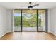 The open balcony features a metal railing and relaxing views of the green space at 3062 Eastland Blvd # 405, Clearwater, FL 33761