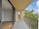 Balcony with metal railing, offers lots of natural light, and calming views of nature at 3062 Eastland Blvd # 405, Clearwater, FL 33761