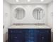Bathroom featuring double sinks, granite countertops, and bright lighting at 3062 Eastland Blvd # 405, Clearwater, FL 33761