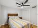 Bedroom featuring a ceiling fan and closet with bi-fold doors at 3062 Eastland Blvd # 405, Clearwater, FL 33761