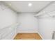 Walk-in closet with hardwood floors and wire shelving at 3062 Eastland Blvd # 405, Clearwater, FL 33761