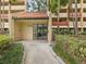The main entrance features well maintained landscaping and an entry door at 3062 Eastland Blvd # 405, Clearwater, FL 33761