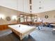 Bright game room boasts wood trim, a pool table, exercise equipment and a table at 3062 Eastland Blvd # 405, Clearwater, FL 33761