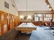 Spacious game room features a pool table, exercise equipment, and plenty of natural light from the window at 3062 Eastland Blvd # 405, Clearwater, FL 33761