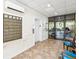 Interior hallway includes mailboxes, elevator access, and seating at 3062 Eastland Blvd # 405, Clearwater, FL 33761