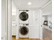 Laundry area featuring a full-size stacked washer and dryer at 3062 Eastland Blvd # 405, Clearwater, FL 33761