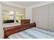 Bedroom with a view of the lanai and a double closet with doors that match the wall color at 3217 Saddlebrook Ave, Tampa, FL 33618