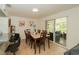 Cozy dining area with sliding glass doors leading to a screened-in patio at 3217 Saddlebrook Ave, Tampa, FL 33618