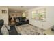 Relaxing living room with a cozy area rug and a view of the backyard at 3217 Saddlebrook Ave, Tampa, FL 33618