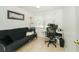 Bright and functional home office setup with desk, chair, and comfortable seating area at 3217 Saddlebrook Ave, Tampa, FL 33618
