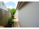 Side yard showing fence and walkway at 3217 Saddlebrook Ave, Tampa, FL 33618