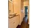Bathroom features vanity with granite countertop and built in storage at 3802 N Oak Dr # W22, Tampa, FL 33611
