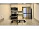 Modern kitchen features granite countertops, stainless steel appliances, and white cabinetry at 3802 N Oak Dr # W22, Tampa, FL 33611
