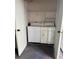 Laundry room featuring a washer, dryer, and wire shelf at 3802 N Oak Dr # W22, Tampa, FL 33611