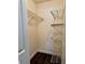 Walk-in closet featuring wire shelving and dark wood-look flooring at 3802 N Oak Dr # W22, Tampa, FL 33611