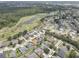 Aerial view of the neighborhood and golf course featuring mature trees and lush landscaping at 3813 Salida Delsol Dr, Ruskin, FL 33573