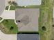 Aerial view of the house with a new roof, well-kept landscaping, and a spacious driveway at 3813 Salida Delsol Dr, Ruskin, FL 33573