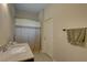 Bathroom featuring a marble countertop, shower with curtain, and neutral color scheme at 3813 Salida Delsol Dr, Ruskin, FL 33573