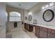 Bright bathroom featuring a glass enclosed shower, a double vanity, and tiled floors at 3813 Salida Delsol Dr, Ruskin, FL 33573