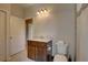 Bathroom featuring a marble countertop, vanity with storage, and tiled floor at 3813 Salida Delsol Dr, Ruskin, FL 33573