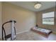 Cozy bedroom featuring tile floors, natural light, and a golf course view at 3813 Salida Delsol Dr, Ruskin, FL 33573