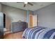 Bedroom with a wooden floor, ceiling fan, and large dresser at 3813 Salida Delsol Dr, Sun City Center, FL 33573