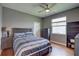 Bedroom with a wooden floor, ceiling fan, and natural light at 3813 Salida Delsol Dr, Ruskin, FL 33573