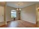 Inviting dining area featuring a chandelier and hardwood floors at 3813 Salida Delsol Dr, Ruskin, FL 33573