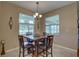 Cozy dining area with natural light, a chandelier, and stylish furnishings that creates an inviting atmosphere at 3813 Salida Delsol Dr, Ruskin, FL 33573