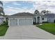 Welcoming single-Gathering home featuring a well-kept lawn and a convenient two-car garage at 3813 Salida Delsol Dr, Ruskin, FL 33573