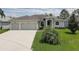 Attractive single-story home with lush green lawn and convenient two-car garage at 3813 Salida Delsol Dr, Ruskin, FL 33573