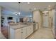 Open concept kitchen features granite countertops, stainless appliances, and convenient access to the living areas at 3813 Salida Delsol Dr, Ruskin, FL 33573