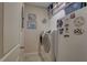 Functional laundry room featuring a washer, dryer, and additional storage space at 3813 Salida Delsol Dr, Ruskin, FL 33573