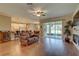 Open floor plan of the living room featuring hardwood floors, access to kitchen and a screened-in lanai at 3813 Salida Delsol Dr, Ruskin, FL 33573