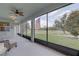 Outdoor lanai offering scenic views of the golf course and plenty of natural light at 3813 Salida Delsol Dr, Sun City Center, FL 33573