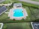 Aerial view of a community pool with ample seating and a nearby parking area at 3813 Salida Delsol Dr, Ruskin, FL 33573