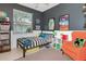 Stylish room with comfortable bed, vibrant decor, and natural light at 3821 Turkey Oak Dr, Valrico, FL 33596