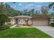 Charming single-story home with manicured lawn, tidy garden beds, and a welcoming two-car garage at 3821 Turkey Oak Dr, Valrico, FL 33596