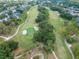 Expansive golf course with rolling greens, mature trees, and sand bunkers, offering a scenic and challenging playing experience at 3821 Turkey Oak Dr, Valrico, FL 33596