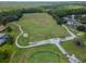 Aerial view of a meticulously maintained golf course with lush green fairways and sand traps, ideal for golf enthusiasts at 3821 Turkey Oak Dr, Valrico, FL 33596