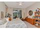 Comfortable main bedroom with bright natural light, backyard access, and a ceiling fan at 3821 Turkey Oak Dr, Valrico, FL 33596