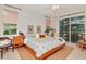 Bright and spacious main bedroom with backyard views and sliding glass door access at 3821 Turkey Oak Dr, Valrico, FL 33596