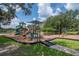 A colorful playground with slides, climbing structures, and swings, offering a fun and safe recreational area for children at 3821 Turkey Oak Dr, Valrico, FL 33596
