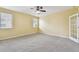 Bedroom featuring bright walls, a ceiling fan, and neutral carpet at 4089 Windcrest Dr, Wesley Chapel, FL 33544