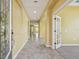 Spacious foyer with tile flooring, arched doorways, and a view into adjacent rooms at 4089 Windcrest Dr, Wesley Chapel, FL 33544