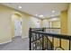 Upstairs hallway featuring neutral paint, carpet, recessed lighting, and an arched doorway at 4089 Windcrest Dr, Wesley Chapel, FL 33544