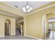 Spacious living room with recessed lighting and archways, seamlessly connects to dining and kitchen areas at 4089 Windcrest Dr, Wesley Chapel, FL 33544